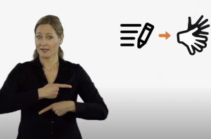 Woman signing international signs about trandslating news into sign language. On the backgroung is a picture: arrow from pencil to signing hands